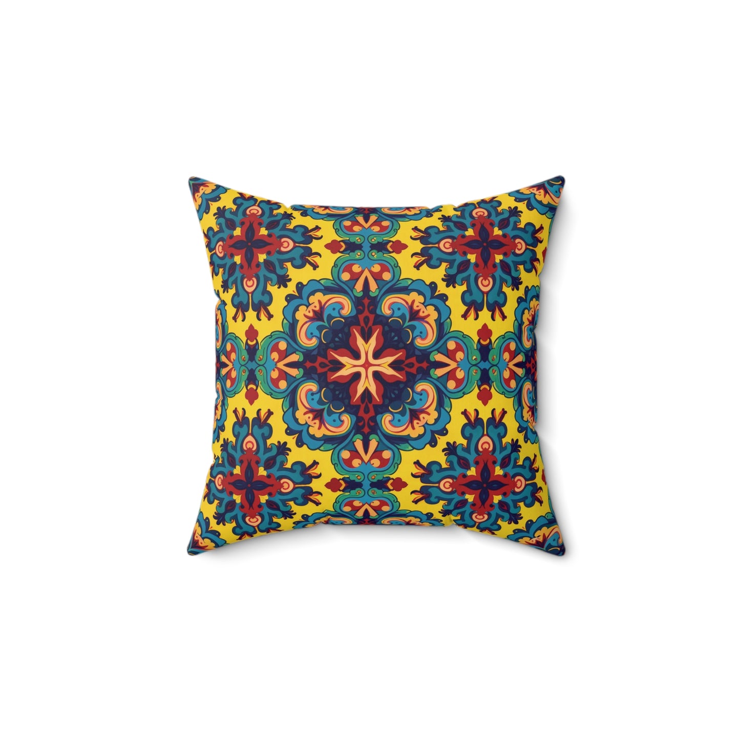 Square decorative faux suede pillow with a symmetrical, ornate pattern in blue, red, green, and orange on a bright yellow background. This African accent pillow features floral and mandala-like shapes radiating from the center for a vibrant look.