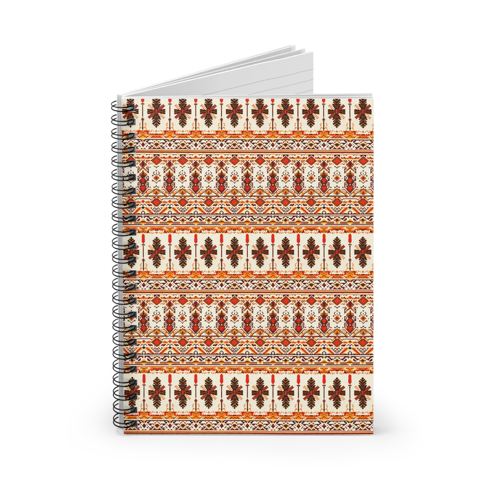 A spiral-bound premium writing journal with a cover showcasing culturally inspired designs. The pattern features horizontal rows of red, orange, black, and white geometric and floral motifs. The notebook is open, revealing blank lined pages inside.