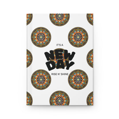 A durable writing journal, this notebook cover features intricate, colorful circular mandala patterns on a white background. In the center, bold black text reads NEW DAY, with smaller text above and below stating ITS A and RISE N SHINE.
