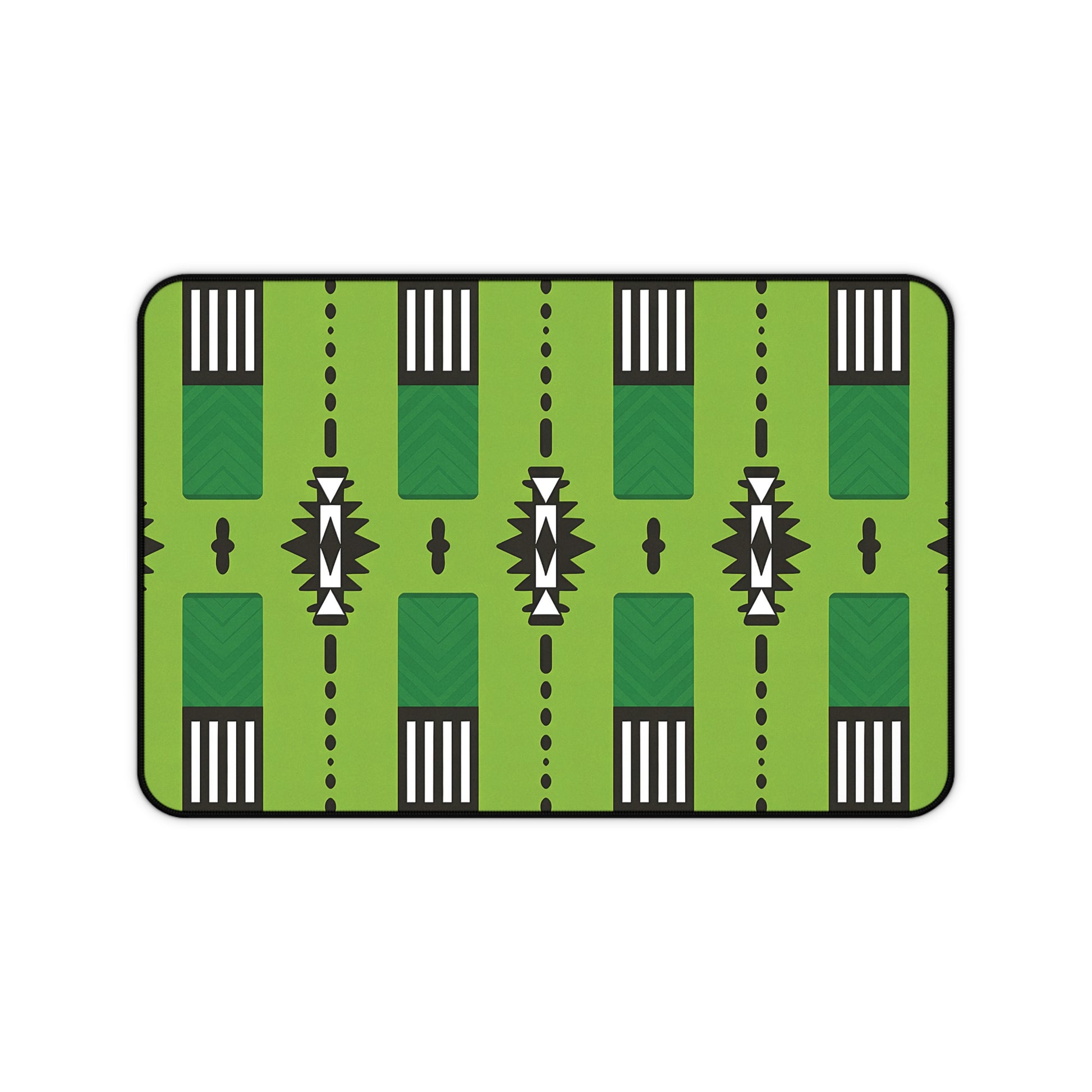 A rectangular Neoprene desk mat featuring a stylized green pattern resembling a football field, with white yard lines, black markings, arrows, chevrons, and geometric accents. Rounded edges and a black border make it an ergonomic desk mat for any workspace.