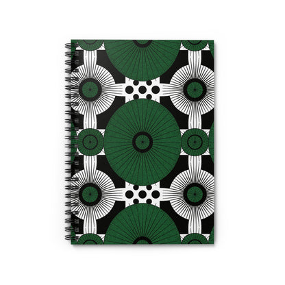 An African-inspired spiral notebook with a bold geometric cover design featuring large green and black circular patterns, concentric white rings, and black polka dots on a white background, all arranged in a symmetrical, repeating pattern.