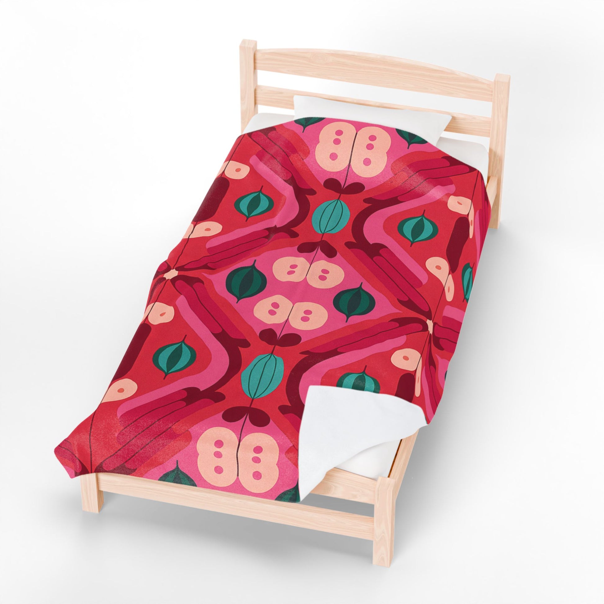 A single wooden bed with a white pillow and an African-inspired blanket featuring a bold, abstract pattern in red, pink, teal, and peach. The geometric design includes rounded shapes and floral motifs for a vibrant, modern look. Set on a white background.