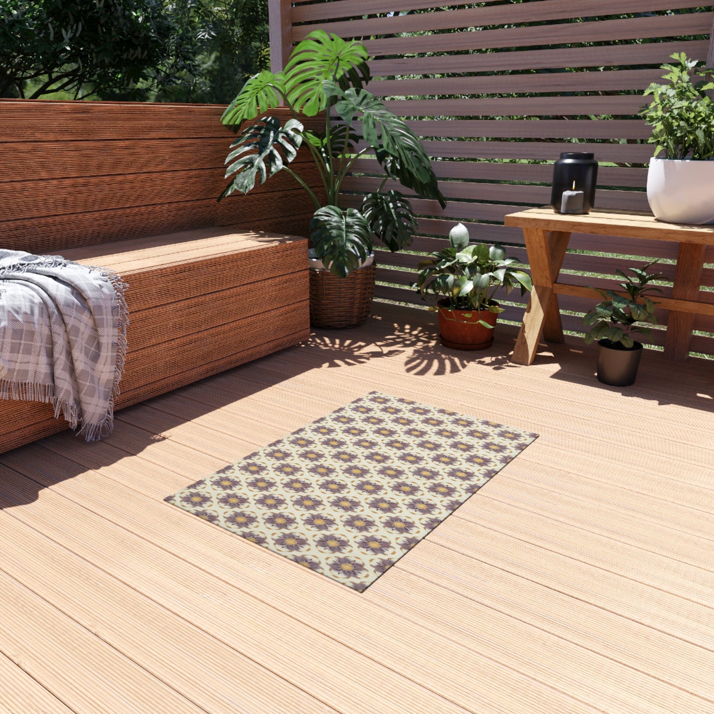 A cozy wooden patio with a bench draped in a gray plaid throw, green potted plants, and an African-inspired patterned rug on the deck. Sunlight streams through slatted wooden fencing in the background, creating a warm and inviting retreat.