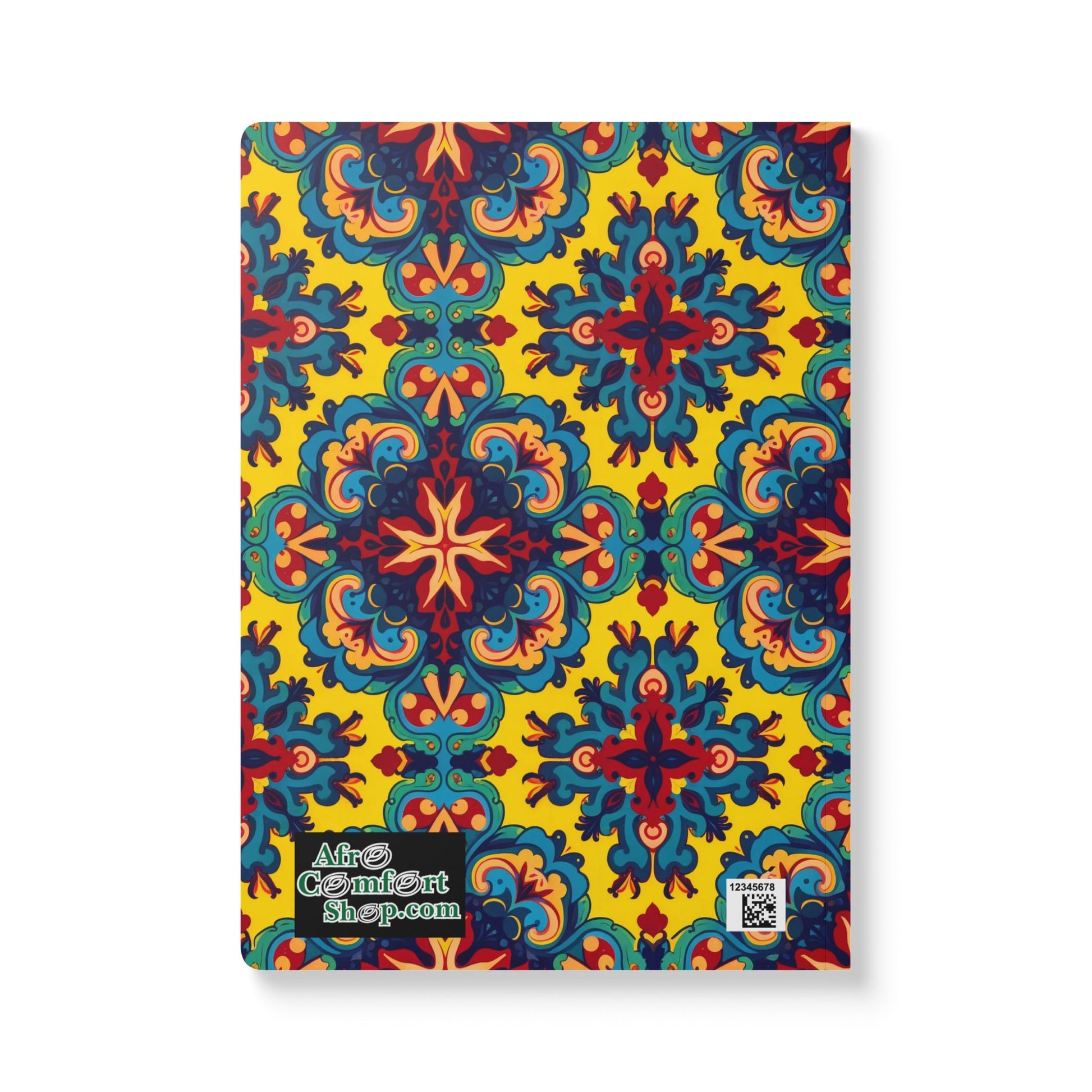 A creative journal with a vibrant, symmetrical floral and geometric pattern in blue, red, and yellow on a yellow background. The bottom left corner features the AfroComfortShop.com logo and a small QR code. Perfect for daily journaling.