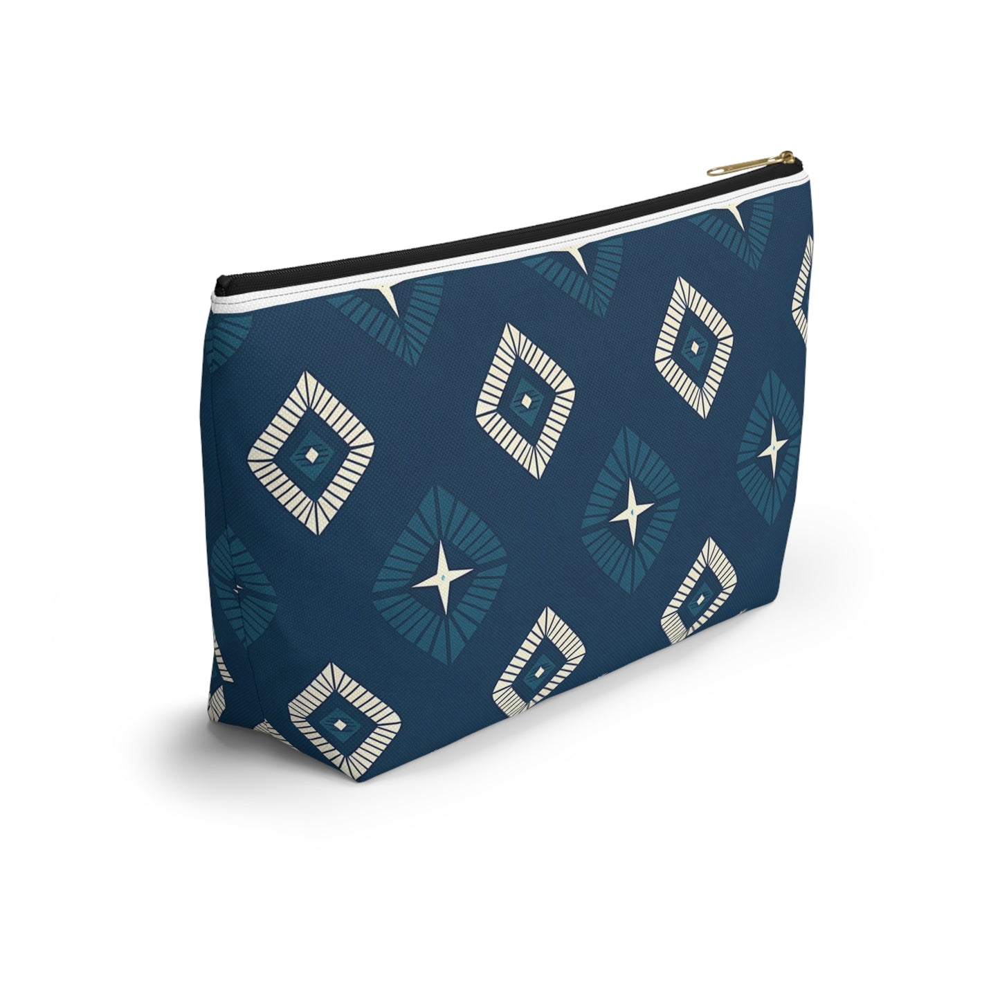 A rectangular T-bottom pouch with a dark blue background, adorned with African-inspired patterns of geometric diamonds in white and light blue. Each diamond has a central starburst design. Perfect as a cosmetic travel bag, it features a gold zipper and black lining.