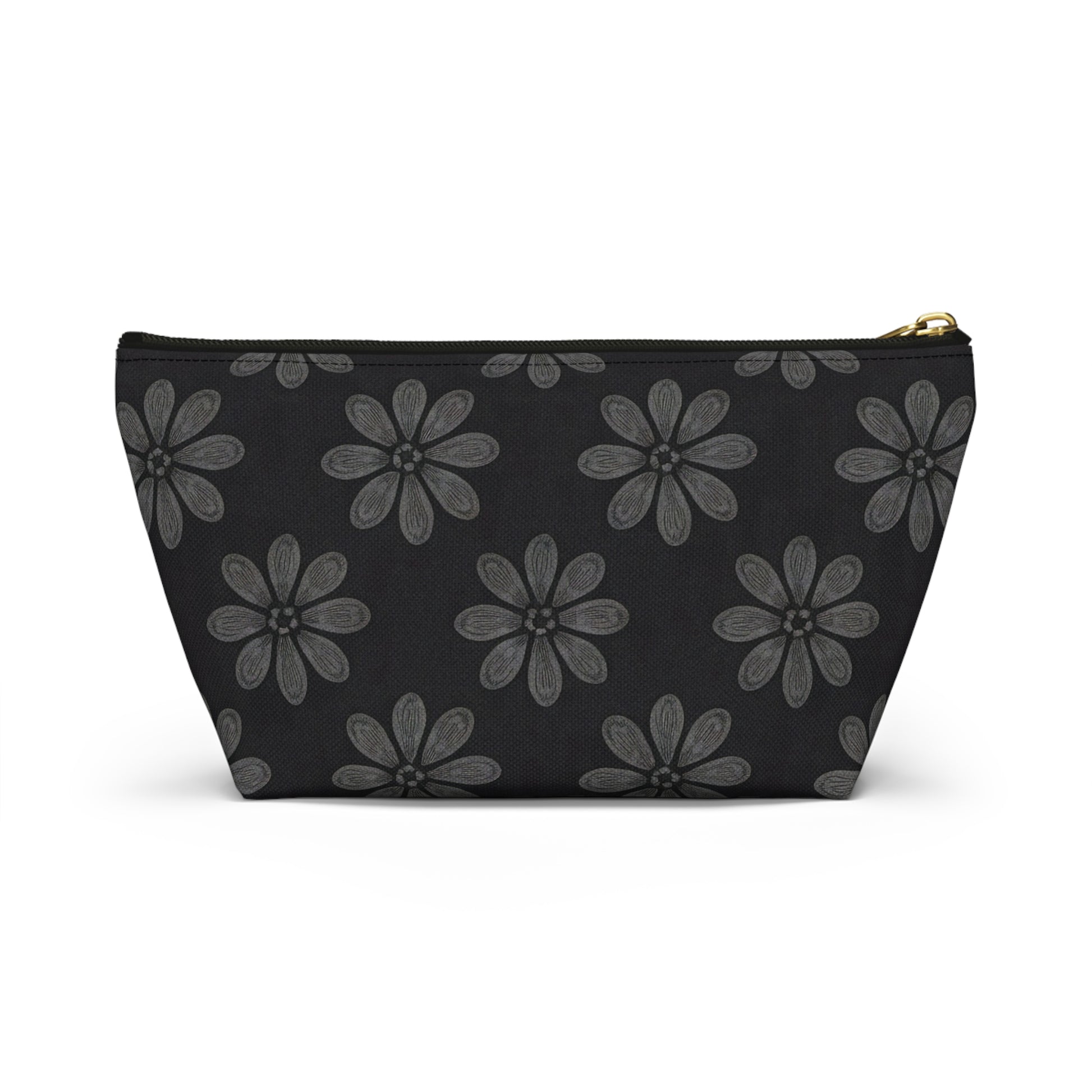 A black T-bottom pouch featuring a repeating pattern of large, stylized gray flowers with six textured petals and dotted centers. The gold zipper and wide base make it a chic cosmetic travel bag with subtle African-inspired patterns.
