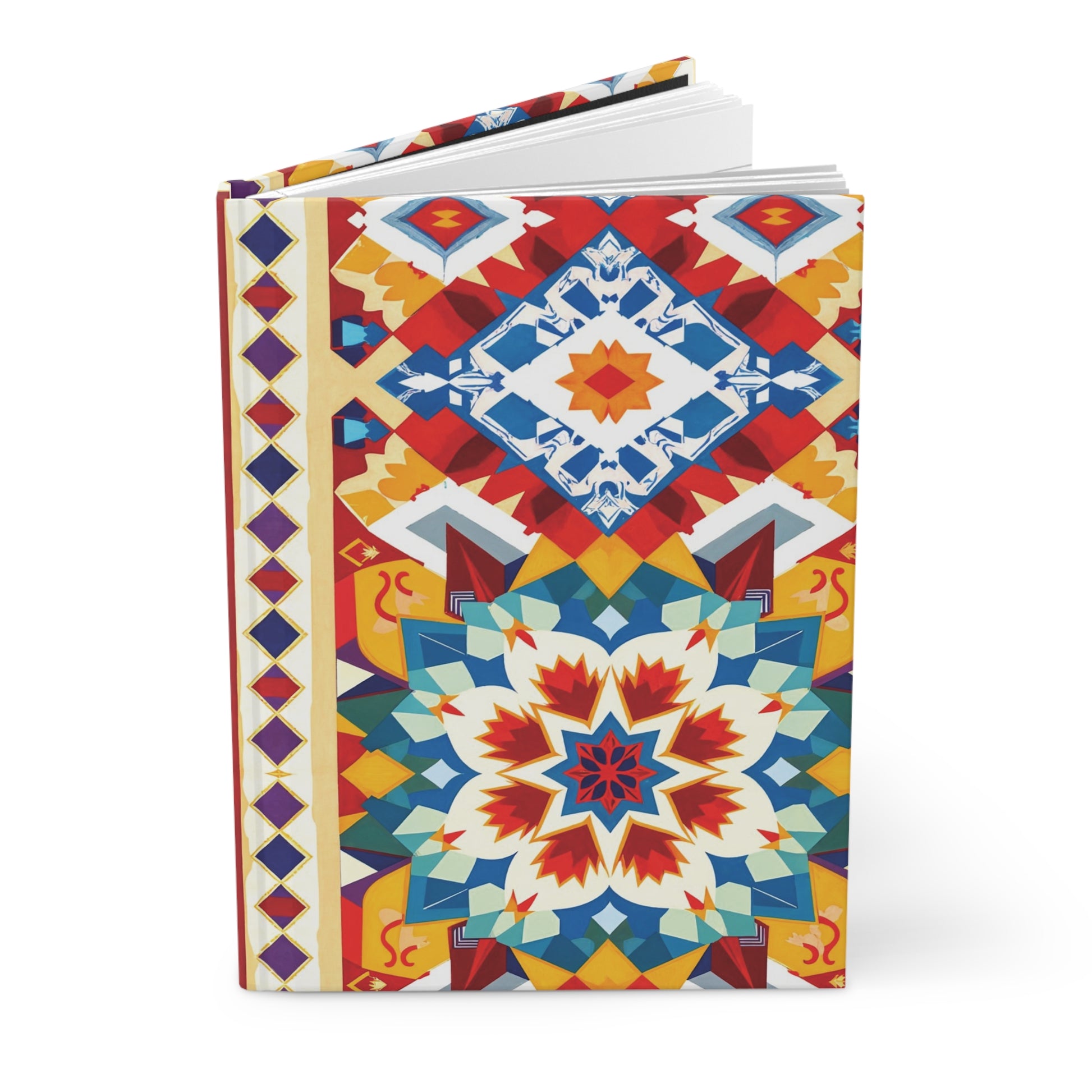 A hardcover journal with a colorful, rainbow geometric design on the cover, featuring interlocking shapes in red, blue, yellow, and white. Symmetrical starburst and diamond motifs create a vibrant, mosaic-like appearance. The book is partly open.