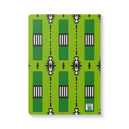 A green creative journal with a repeating geometric pattern in black and white. The design features vertical rectangles, stripes, arrow shapes, and diamond accents—perfect for daily journaling. A small white label with a QR code is in the lower right corner.