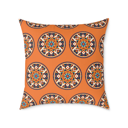 Square pillow with an orange background featuring a repeating pattern of circular, radial mandala designs in blue, black, red, and white. This African-inspired pillow brings colorful accents and a symmetrical, intricate look to your home decor.