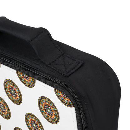Close-up of an African-inspired lunch bag with a white section featuring a repeating colorful, circular mandala-like pattern. The image highlights the black zipper, stitched handle, and part of the curved edge against a plain background.