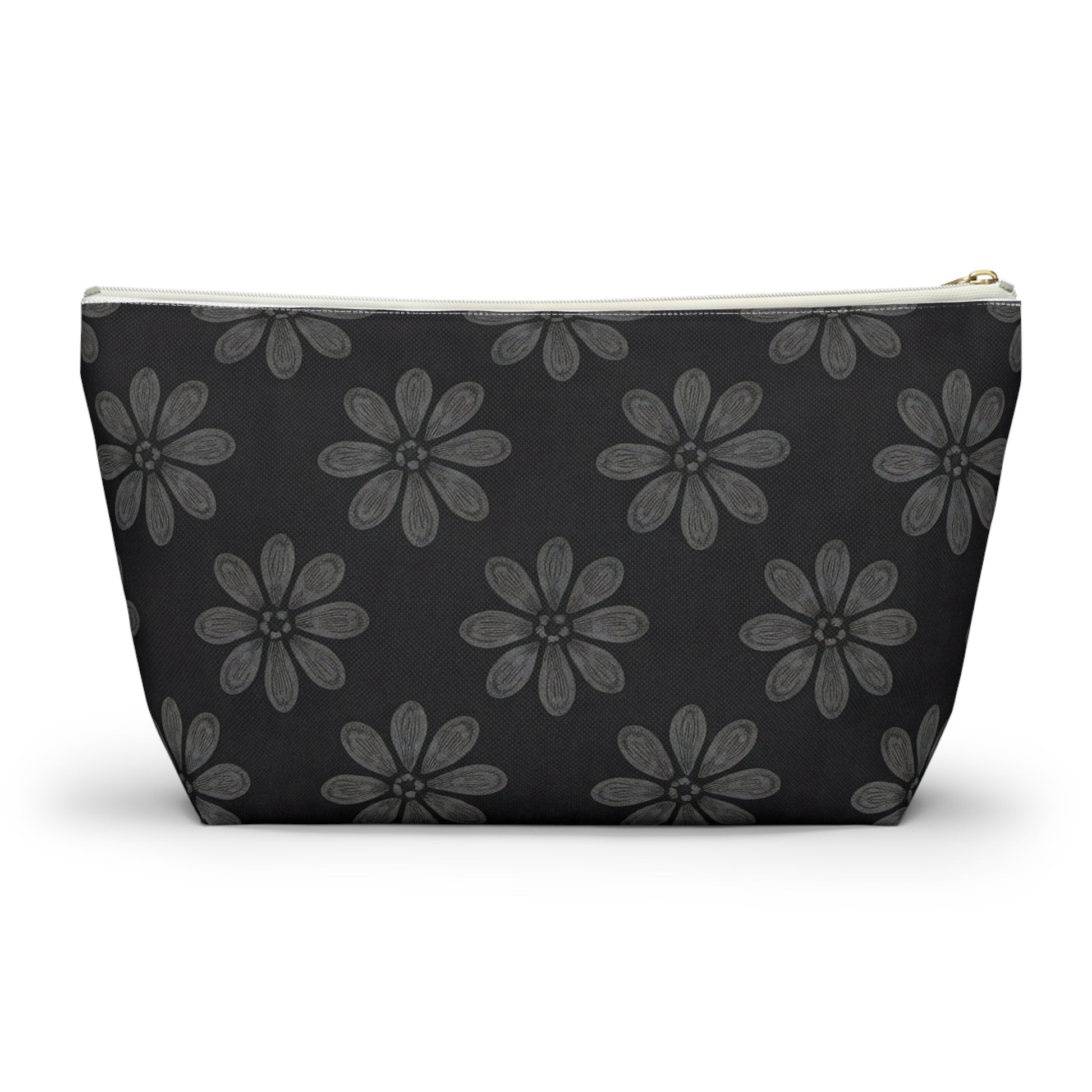 A zippered cosmetic travel bag with a black background, decorated with a repeating pattern of large, hand-drawn, gray daisy-like flowers. This T-bottom pouch tapers towards the base and features a white zipper and gold zipper pull.