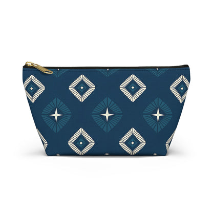 A zippered T-bottom pouch with a gold zipper, featuring African-inspired patterns of geometric diamonds in white and dark blue. Each diamond has a star-like center, creating a modern, stylish cosmetic travel bag.