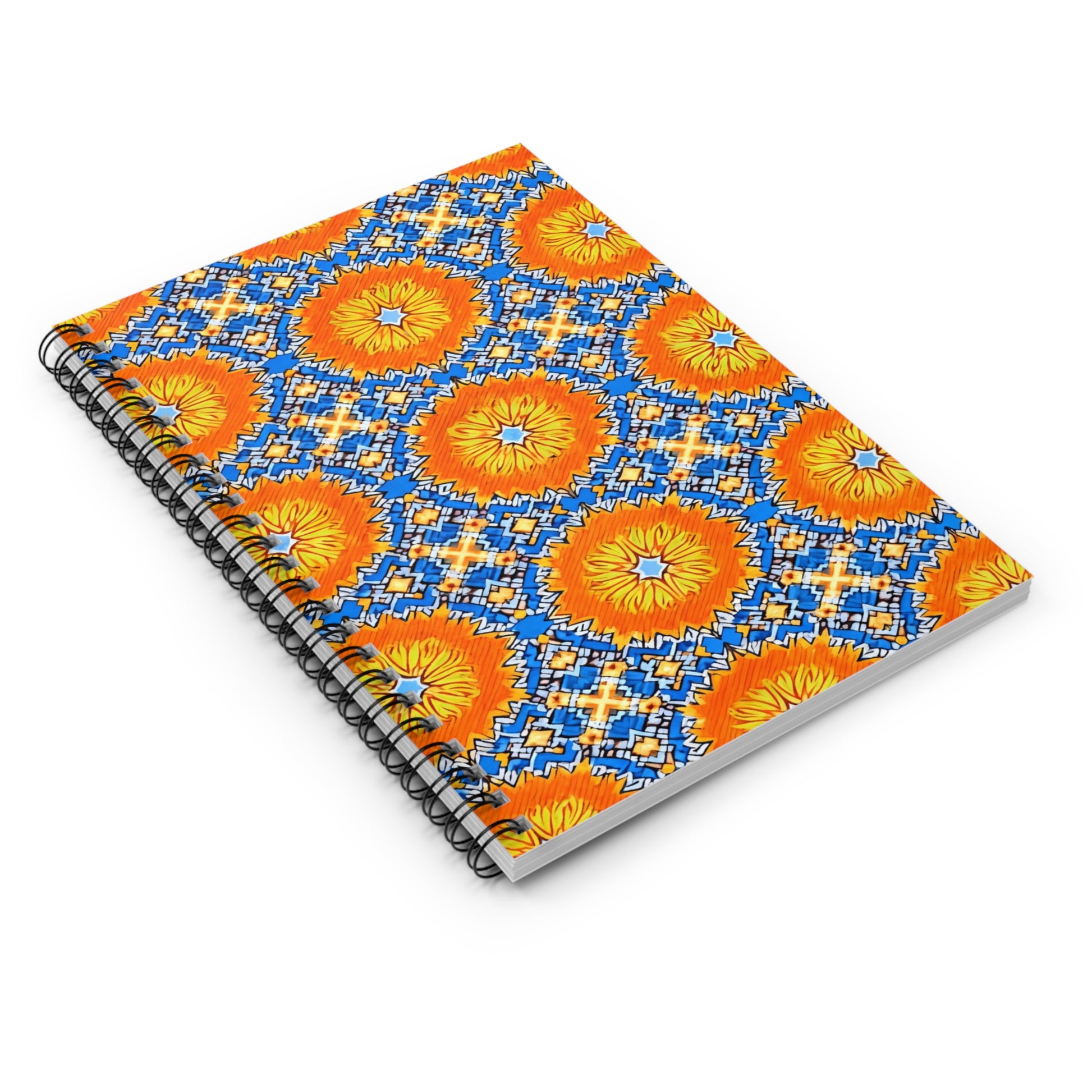 A spiral notebook with a vibrant cover featuring intricate, African-inspired geometric patterns in blue, orange, and yellow. The sunburst shapes and diamond motifs evoke culturally inspired designs for a premium writing experience.