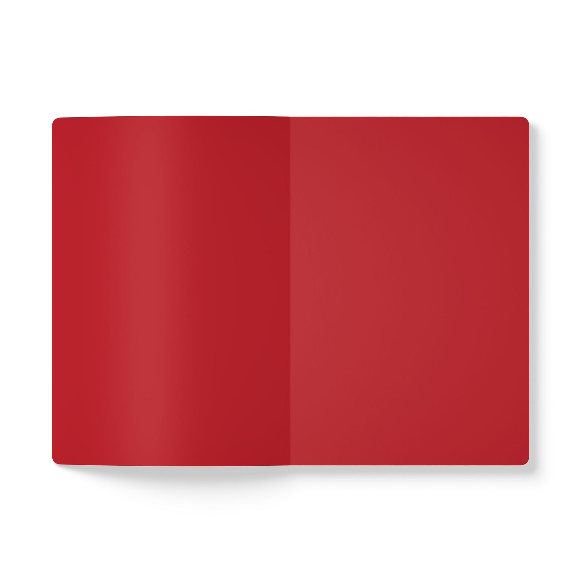 An open African-inspired journal with blank red pages lies flat on a white background. Both the left and right pages are solid red, ideal for creative journaling, with a soft shadow adding depth and dimension.