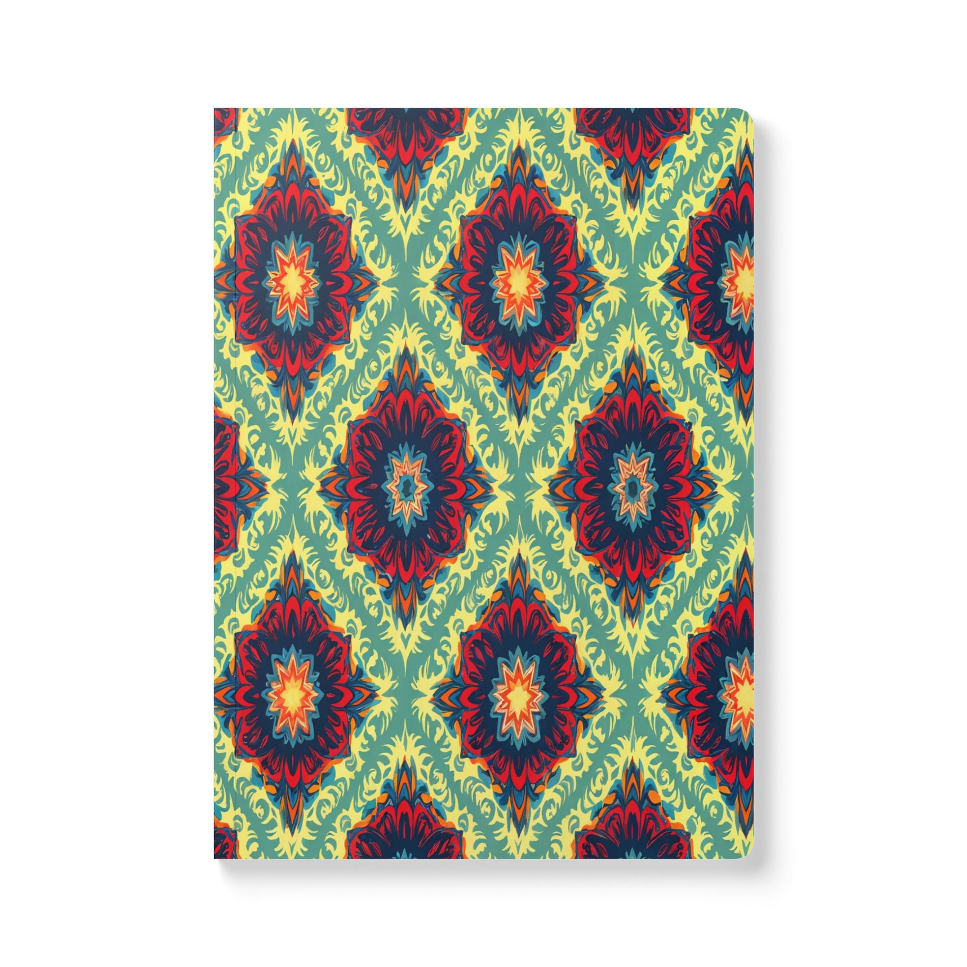 A rectangular African-inspired journal with a vibrant, repeating geometric floral pattern in red, orange, blue, and yellow on a green background, forming diamond shapes throughout. Perfect for creative journaling, the book is viewed from a slightly angled front perspective.