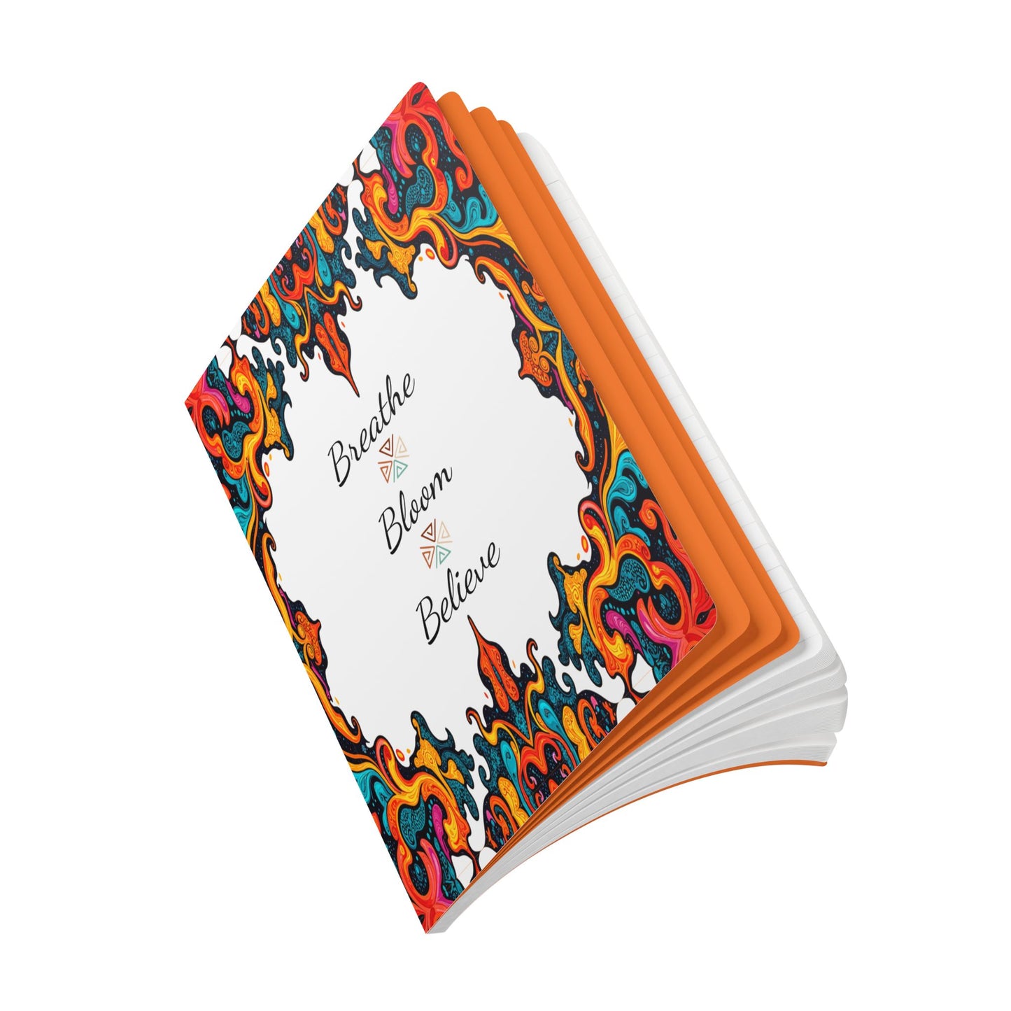 A creative journal with a vibrant, ornate, swirling floral border in red, orange, blue, and black on the cover. “Breathe Bloom Believe” is elegantly scripted at the center. Perfect for daily journaling, the pages and edges are white and orange.