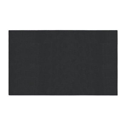 A rectangular, solid black mat with a smooth texture is shown against a plain white background. This custom floor mat appears to be flat and medium thick, making it ideal for yoga, exercise, or as a stylish floor protector in African-inspired home decor.