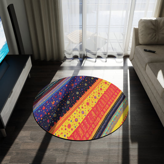 A vibrant round rug, inspired by African patterns and crafted from soft polyester chenille, sits on a dark wooden floor between a beige sofa and TV stand. Sunlight streams through sheer curtains, casting playful shadows across the room and the colorful rug.