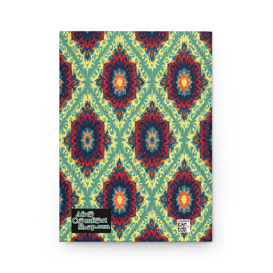 A notebook with a vibrant, symmetrical geometric cover in red, blue, and yellow-green, resembling mandala shapes. Perfect as an African-inspired personalized journal. AfroCentrArt shop.com and a QR code are printed in the lower left corner.