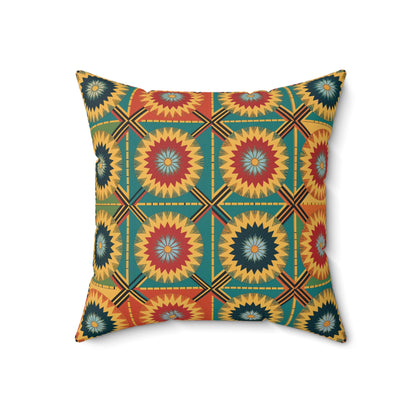 A square throw pillow with a vibrant, African-inspired starburst pattern in red, yellow, teal, and dark blue. Interlocking squares with zigzag circles radiate atop a muted green background—perfect for adding flair to your home decor.
