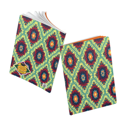 Two notebooks with vibrant, African-inspired journal covers showcase red, blue, and dark teal flower-like shapes on a yellow-green background. Perfect for daily journaling or as a creative journal. One is open to crisp white pages; both feature a gold sticker.