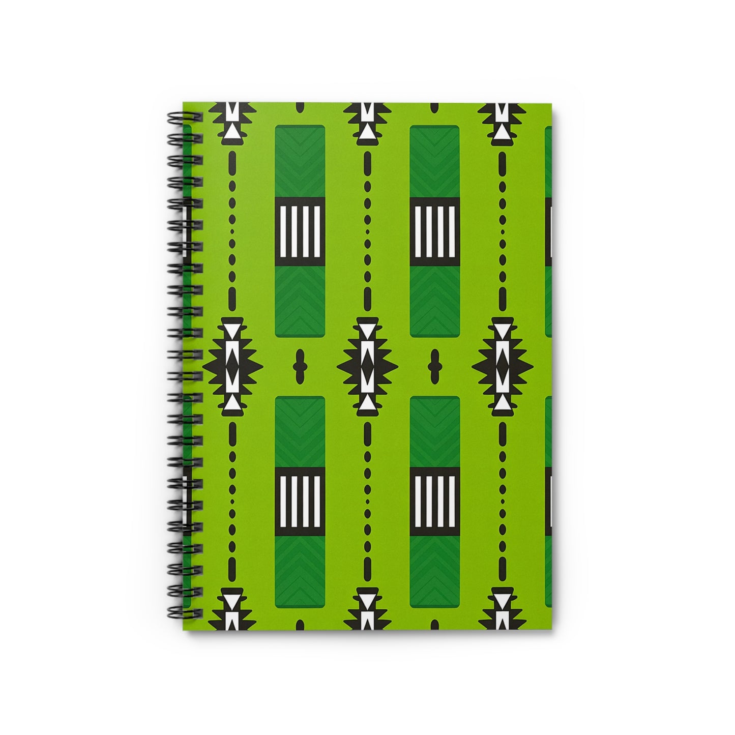 A green spiral notebook with a bold geometric cover inspired by African pattern notebook designs—vertical rectangles, black and white triangles, small circles, and dot lines arranged symmetrically with black, white, and dark green accents.