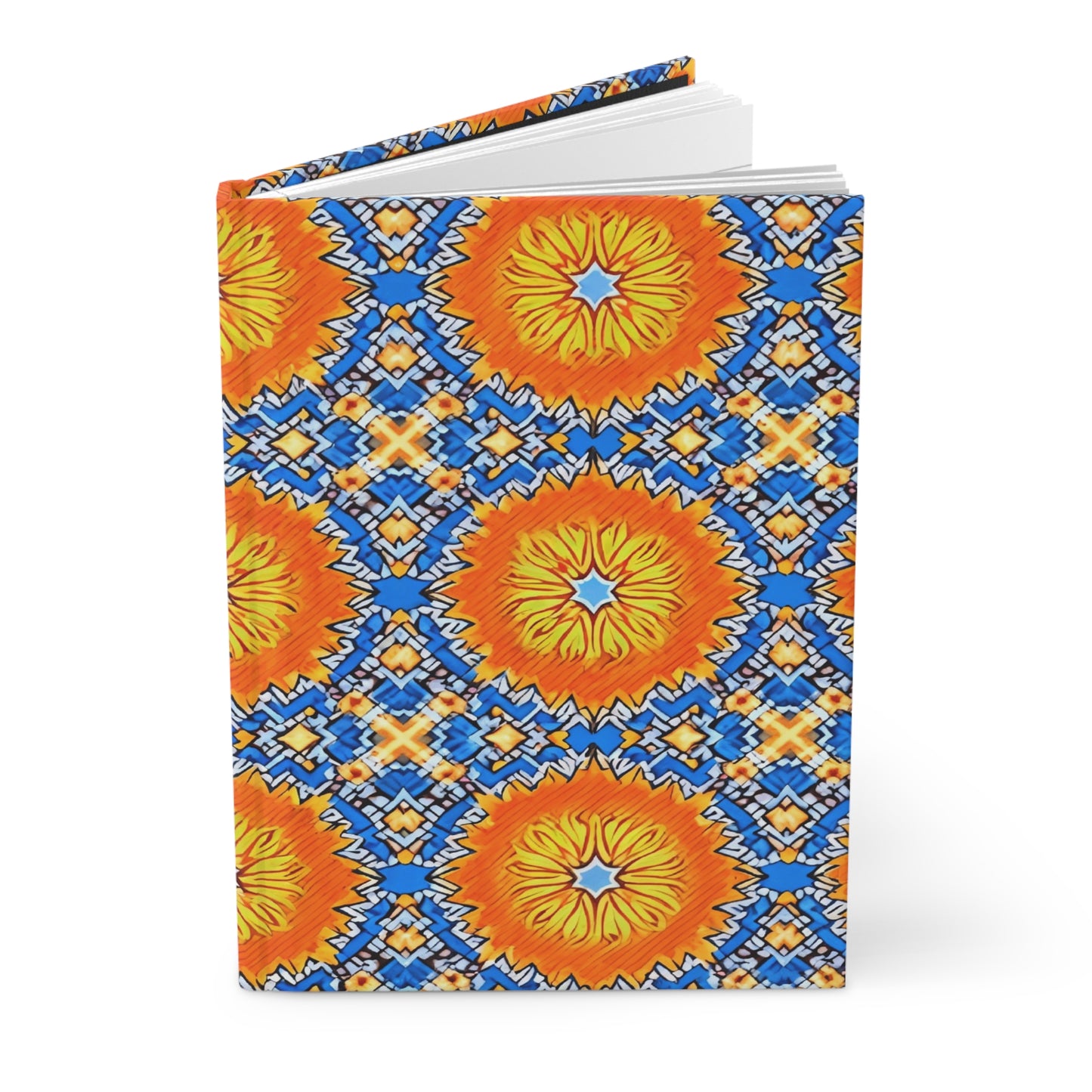 A hardcover notebook with a vibrant sunburst design, inspired by African patterns, features large orange and yellow circles surrounded by intricate blue, white, and yellow geometric shapes on a light blue background. The African-inspired journal is partially open.