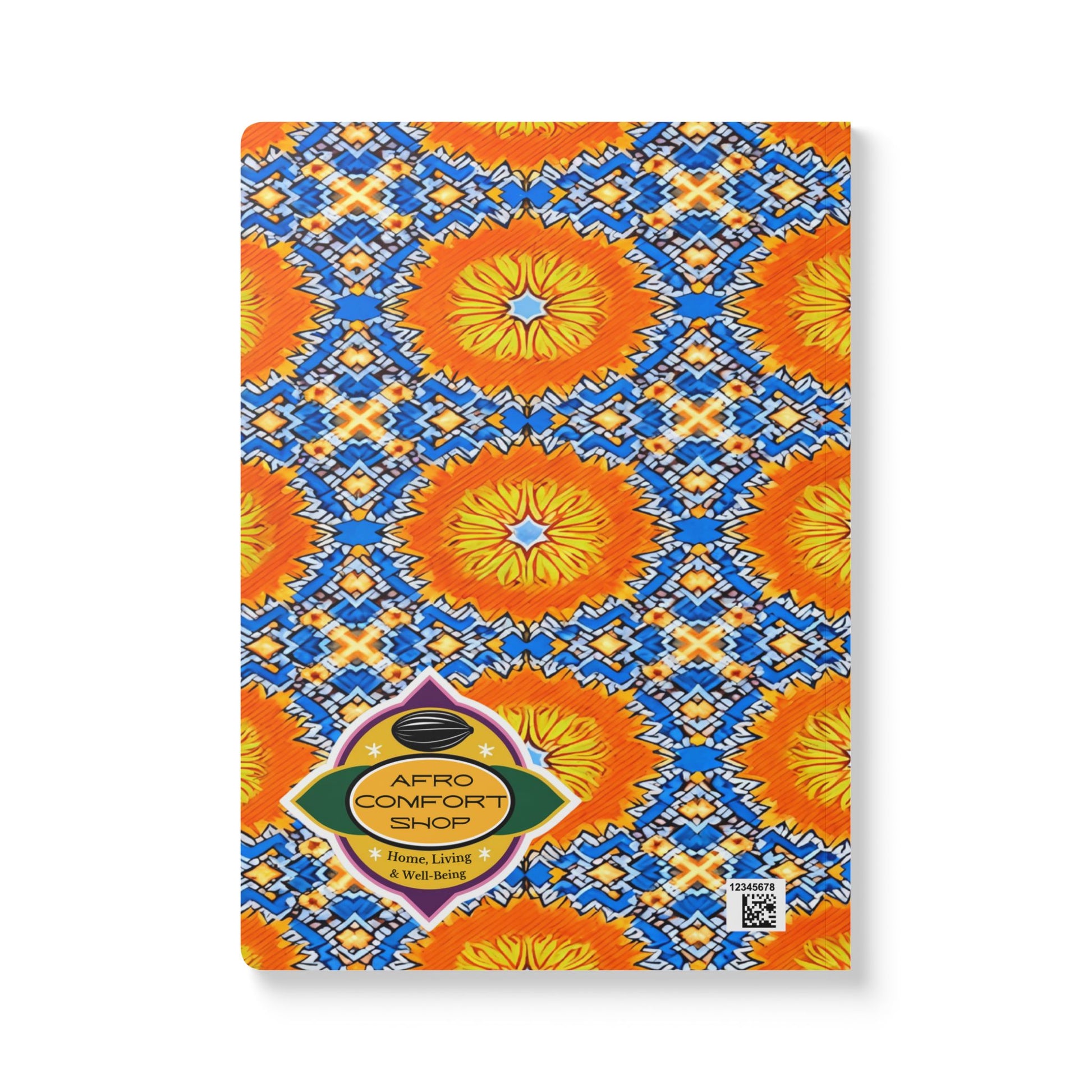 A rectangular African-inspired journal with a vibrant cover featuring orange and yellow circular patterns, blue geometric shapes, and white accents. Perfect for daily journaling, it features the Afro Comfort Shop logo and a QR code in the lower right corner.