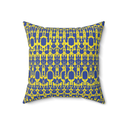 Square pillow with a bold, symmetrical pattern in bright yellow and royal blue. This faux suede pillow features abstract shapes and vertical lines, creating a dynamic geometric motif—a striking African accent pillow on a plain white background.
