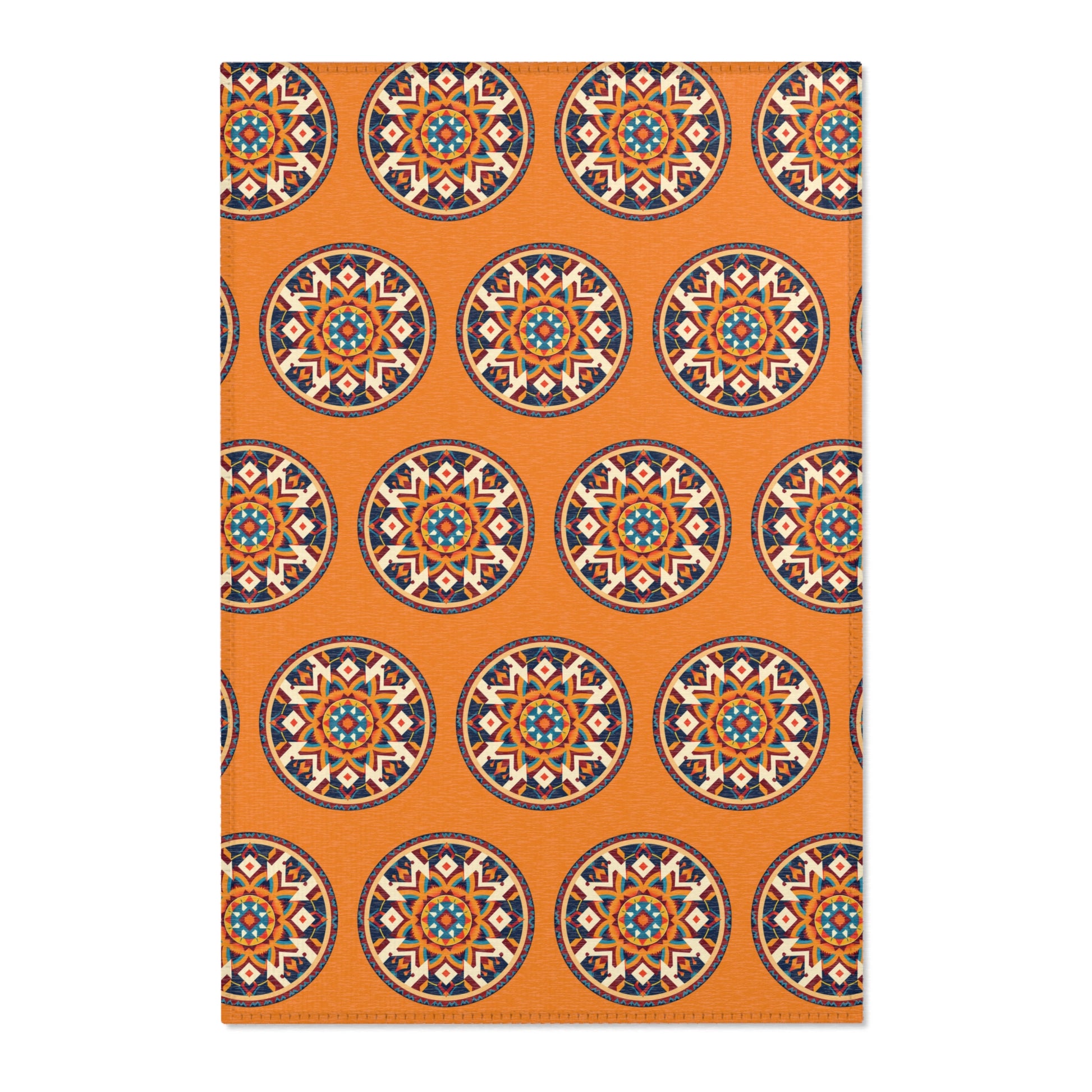Rectangular orange rug with a repeating pattern of African-inspired circular medallions. Each medallion boasts intricate geometric and floral motifs in navy, teal, cream, and coral, evenly spaced across the entire surface.