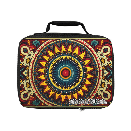 A rectangular African-inspired lunch tote with a vibrant mandala design in red, yellow, blue, and green. This insulated lunch bag has a black handle and features “EMMANUEL” in bold white letters on a cream and brown patterned background.