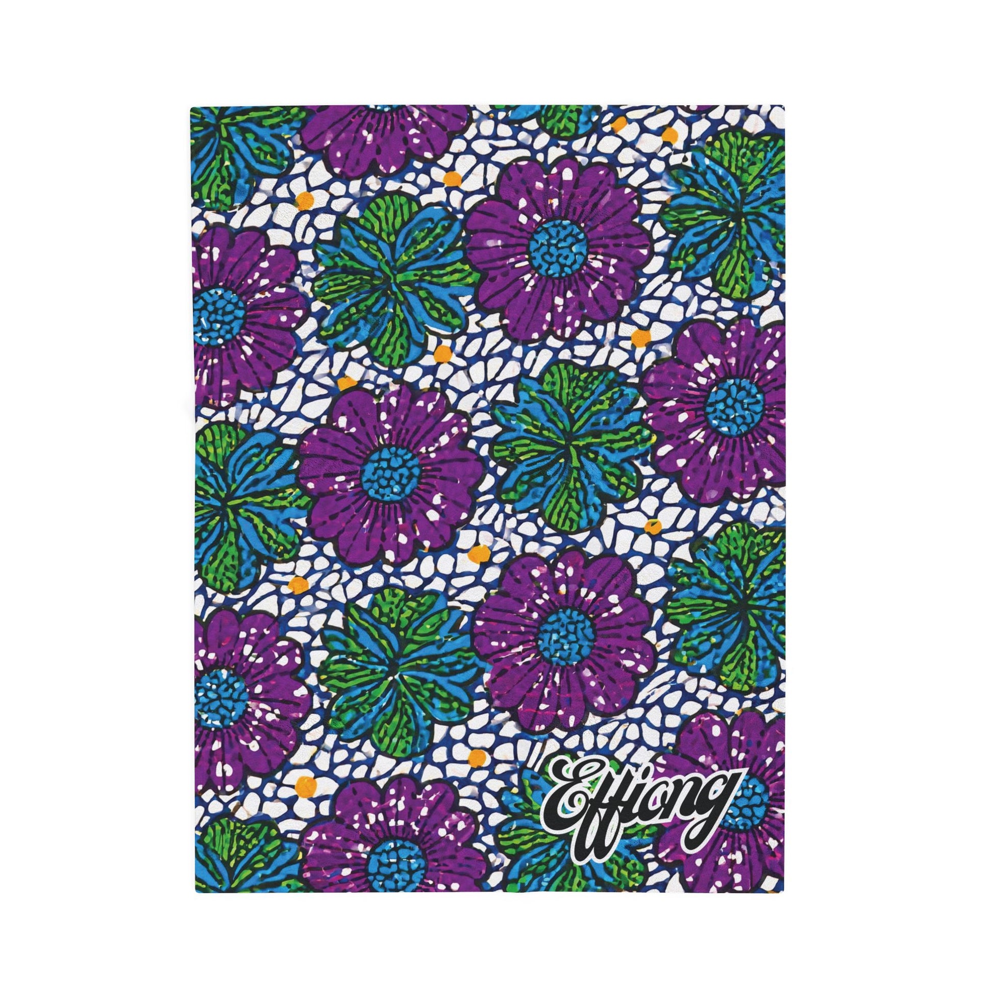 A notebook cover with a colorful floral pattern of large purple flowers and green leaves on a dark blue and white mosaic-like background, inspired by African-inspired blanket designs. The name Effiong appears in bold cursive in the bottom right corner.