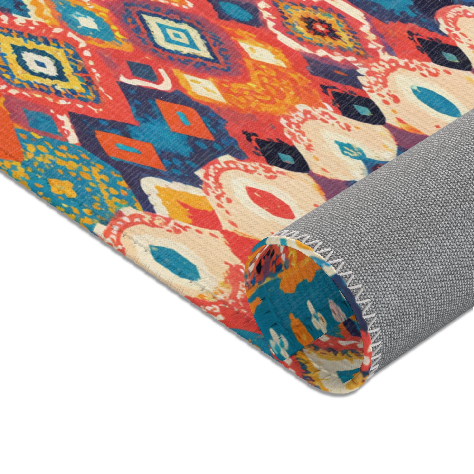 A rolled, colorful rug with a vibrant geometric pattern in red, blue, yellow, orange, and white. Crafted from durable polyester, this stylish home decor piece features a non-slip gray underside and bold shapes inspired by African design rugs.