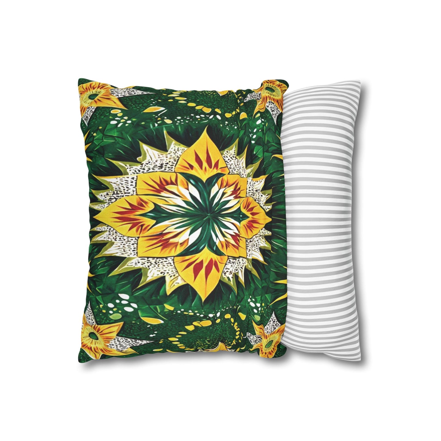 A rectangular pillow with vibrant, symmetrical floral African motifs in yellow, green, and white rests partly on another pillow with a simple gray and white horizontal striped design, both set against a white background.