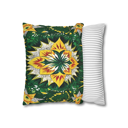 A rectangular pillow with vibrant, symmetrical floral African motifs in yellow, green, and white rests partly on another pillow with a simple gray and white horizontal striped design, both set against a white background.