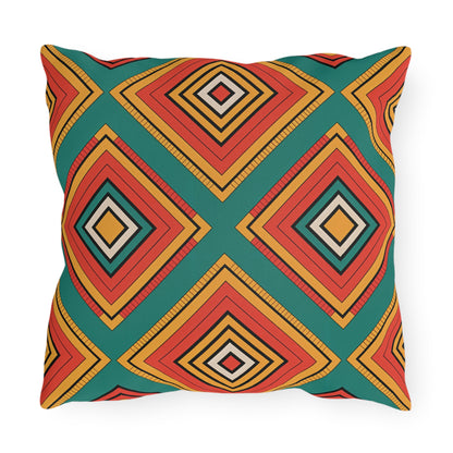 Square outdoor pillow with a bold geometric pattern of overlapping diamonds in vibrant colors on a teal background. Made from weatherproof materials, this modern design is both eye-catching and durable—perfect for any space.