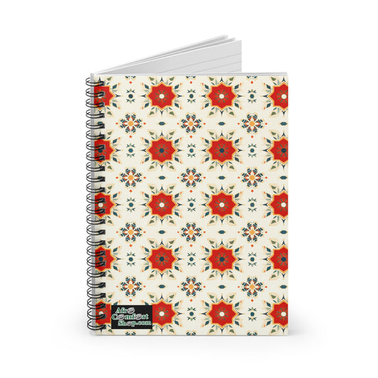 A spiral notebook with a cover featuring African-inspired geometric floral shapes in red, orange, and green on a cream background. Enjoy a premium writing experience with culturally inspired designs. Black label reads The Confident Shop.com.