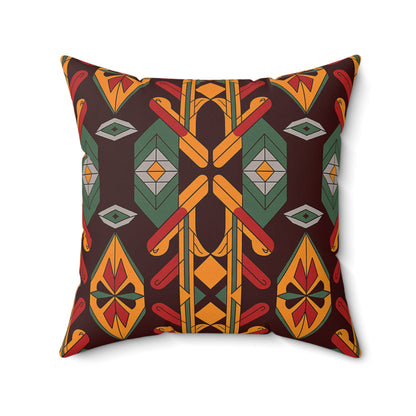 A square African accent pillow with a bold geometric pattern in red, yellow, green, orange, and gray on a dark brown background. Its symmetrical design and vibrant colors create a stunning tribal-inspired faux suede pillow.