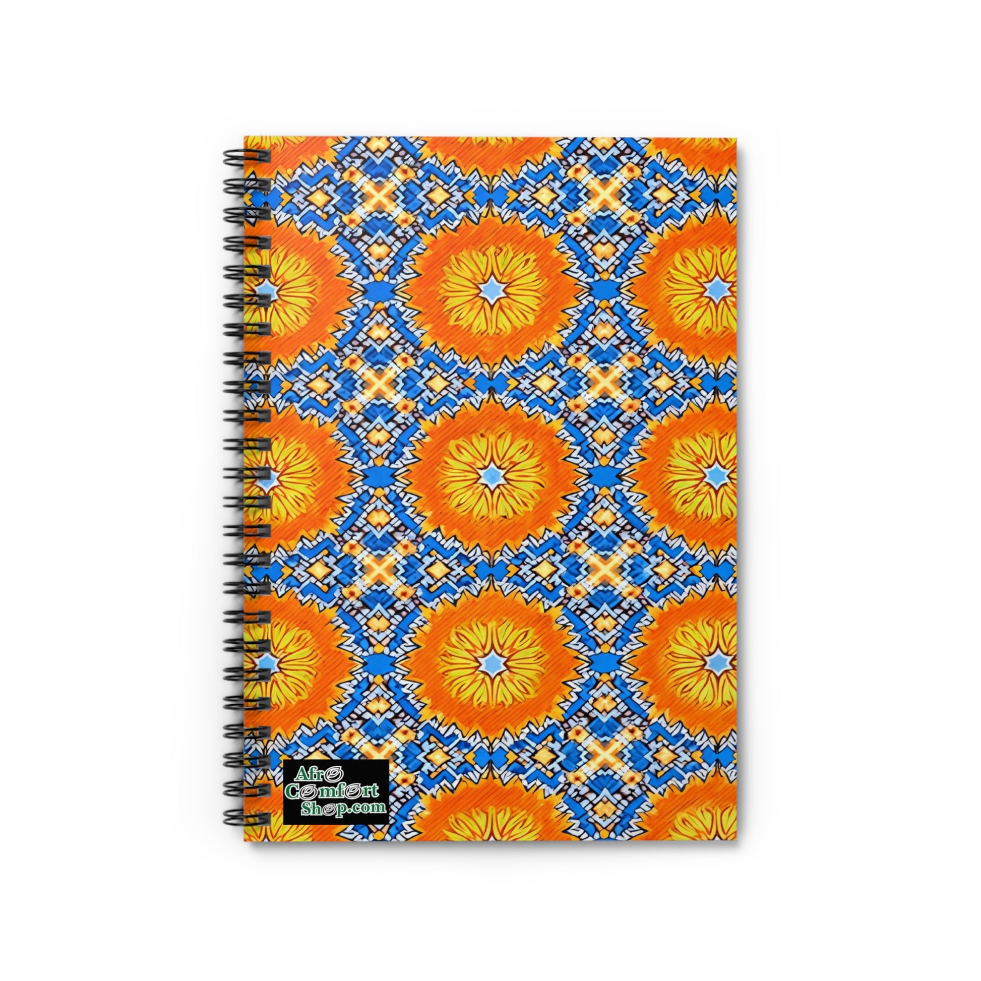 A spiral-bound notebook with a vibrant cover featuring African-inspired, culturally inspired designs—large orange and yellow flowers, blue diamond shapes, and small white accents. A sticker in the bottom left corner reads “Adam Calendar shop.com.”.