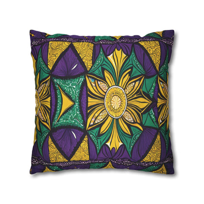 A rectangular pillow with vibrant African patterns in yellow, green, and purple. The design features a large central flower with leaf shapes and intricate decorative details, set against a background of alternating colored shapes.