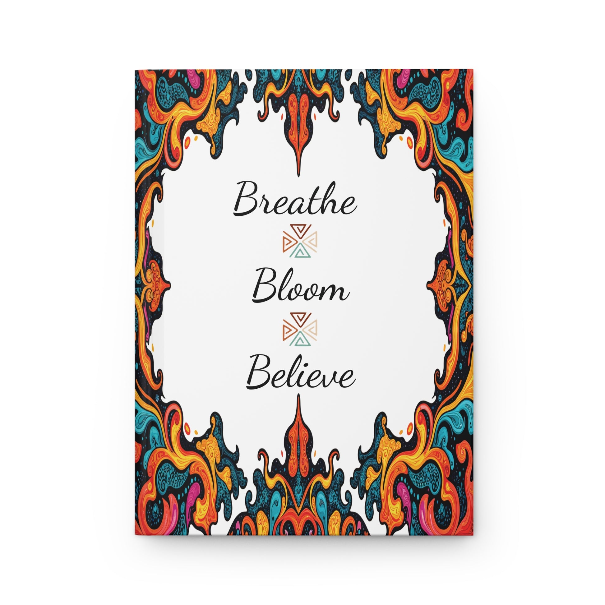 A decorative poster with swirling, colorful patterns in red, orange, blue, yellow, and black framing the edges. In the white center, black cursive text reads Breathe Bloom Believe—perfect for your wellness ritual or African-inspired journal nook.