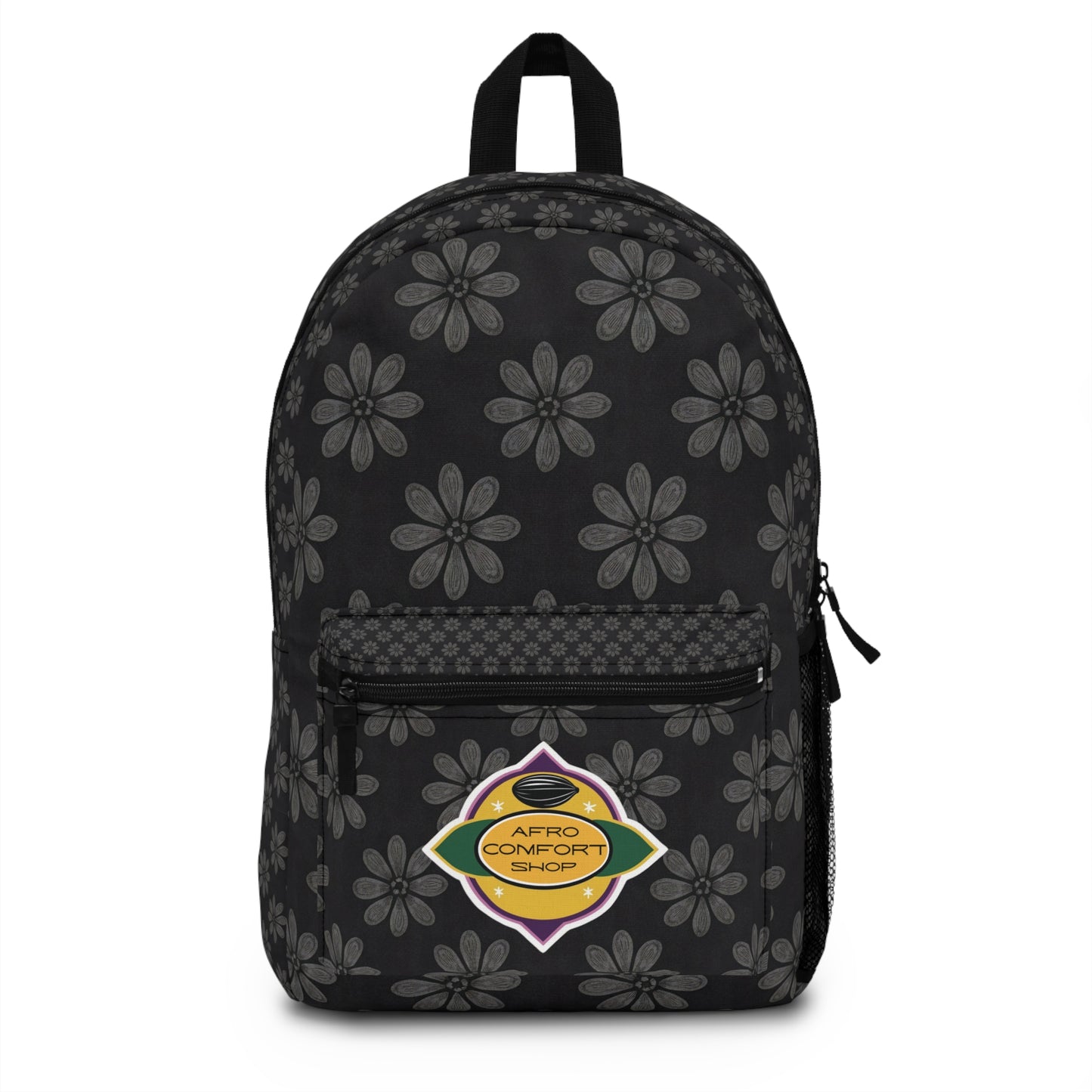 A black, African-inspired backpack with gray floral patterns, a front zip pocket, and a side mesh pocket. The front pocket features a colorful oval patch reading Afro Comfort Shop, echoing the Pan-African flag and celebrating culturally inspired designs.