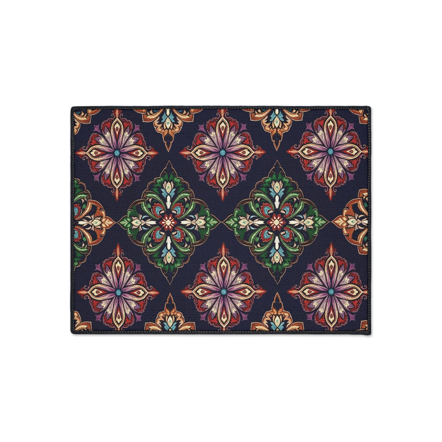Rectangular rug with an African-inspired, repeating geometric floral pattern. Ornate, symmetrical motifs in green, red, purple, orange, and beige on a dark navy blue background create a vibrant look. Features non-slip rubber backing for added safety.