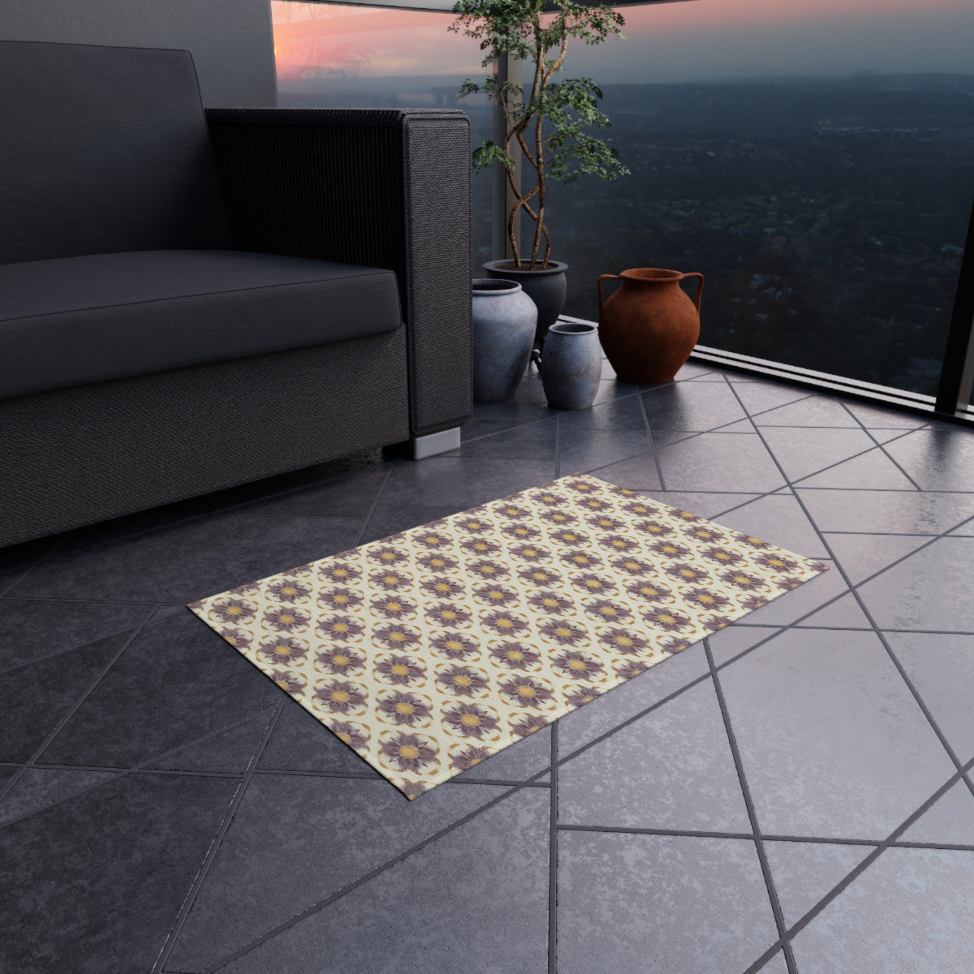 An African-inspired patterned rug with a yellow and brown geometric design lies on a tiled floor near a black sofa. Three decorative vases and a leafy potted plant are in the corner, while large glass windows overlook a cityscape at sunset.