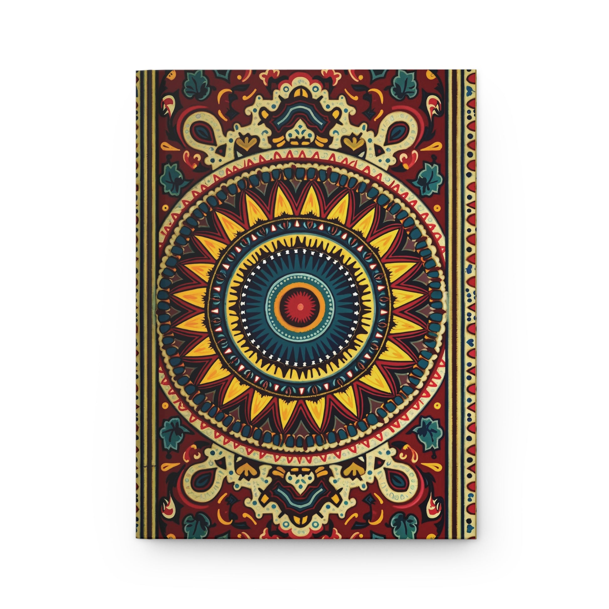 A vibrant hardcover journal with a mandala-style design. The central circular pattern has yellow, blue, and red shapes radiating outward. Deep red background with ornate gold, teal, and cream motifs. Includes lined pages for writing or sketching.