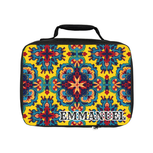 A customizable insulated lunch tote with a black handle and zipper, featuring a vibrant, symmetrical floral pattern in red, blue, green, and yellow on a bright yellow background. The name “EMMANUEL” is printed in bold white letters at the bottom right.