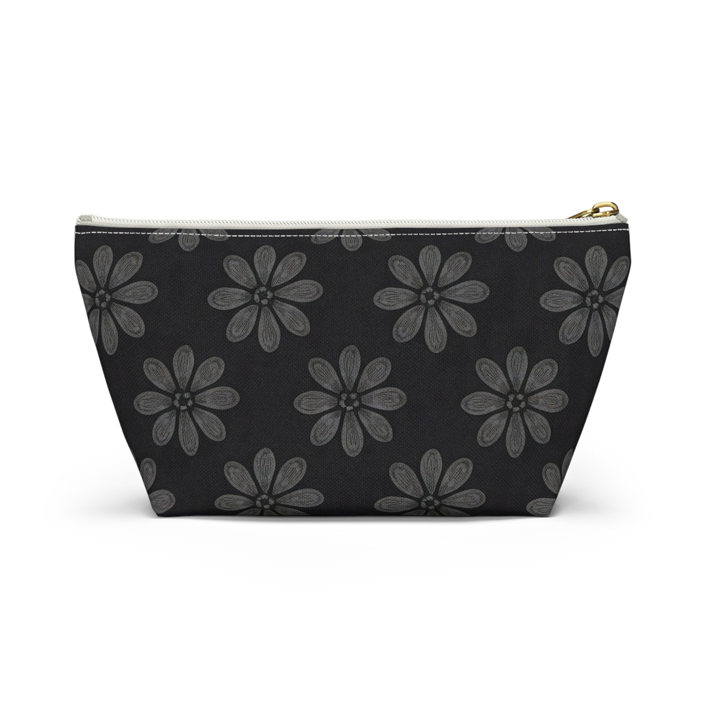 A zippered T-bottom pouch with a black background features a repeating pattern of large, stylized gray flowers with six petals each. The white zipper has a gold pull tab. Perfect as a cosmetic travel bag, it’s displayed against a plain white backdrop.