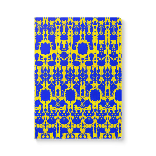 A creative journal with a cover featuring an intricate, symmetrical pattern in blue and yellow. The African-inspired design of repeating geometric shapes creates a bold, vibrant look—perfect for daily journaling on a striking white background.