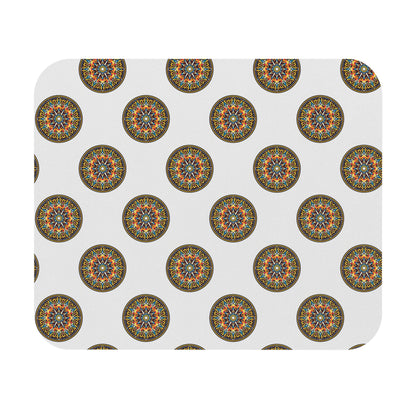 A white rectangular African-inspired mouse pad with rounded corners features colorful mandala designs in red, blue, orange, and green. This durable desk accessory boasts a non-slip rubber base and a visually appealing, repeating motif.