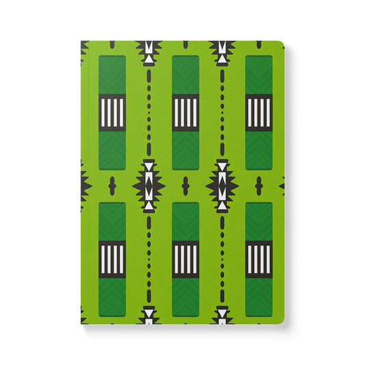 An African-inspired journal with a bright green cover featuring geometric patterns, black and white striped elements, starburst shapes, and small black oval motifs. Perfect for daily journaling, this notebook has rounded corners and is set against a white background.
